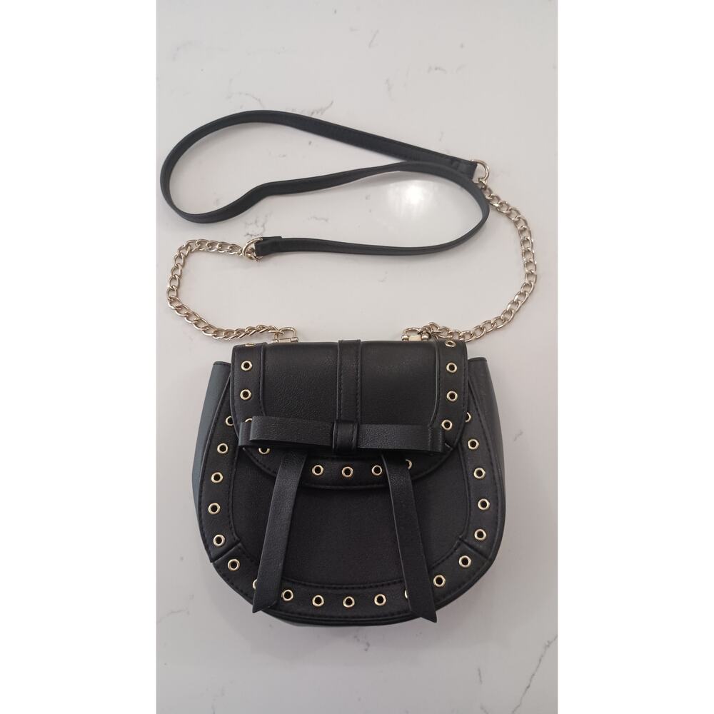 The Express Black Crossbody embellished with Bow metal grommets flap  closure. - Picture 3 of 12